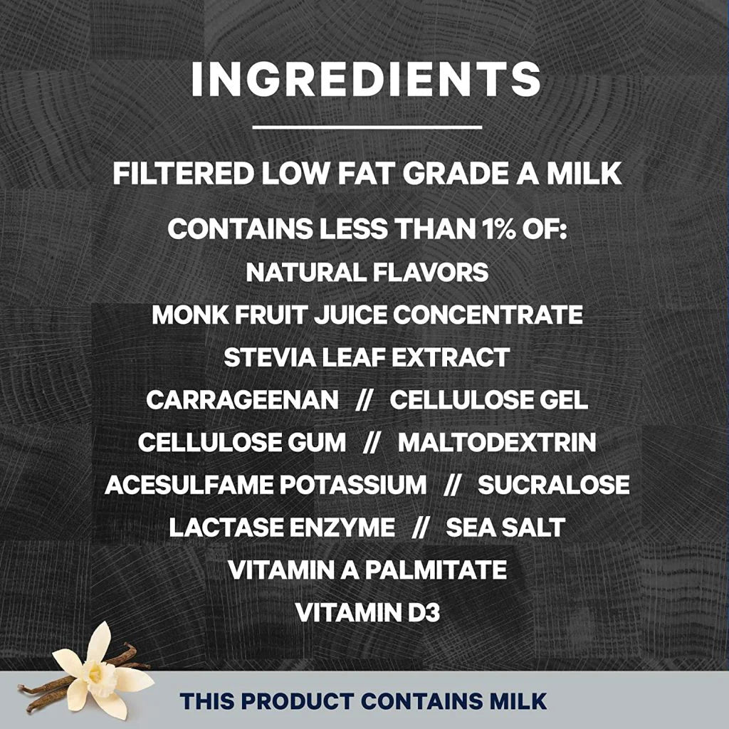 Ingredients list for Fairlife Core Power Elite Vanilla protein shake on a dark wood background with vanilla bean and flower.