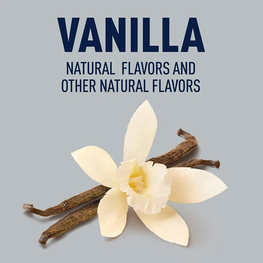 Vanilla flower with three dark brown vanilla beans on a gray background.